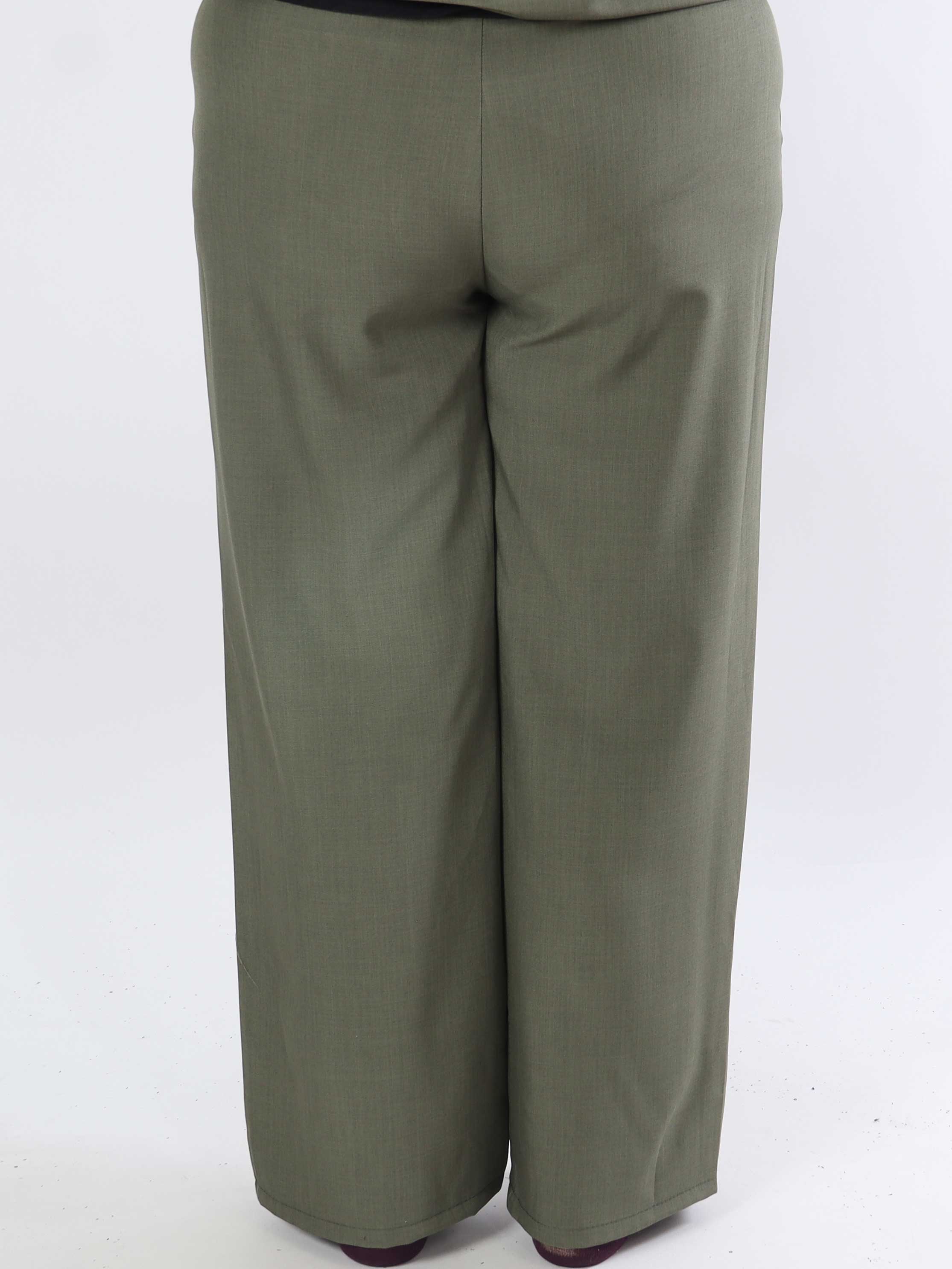 Shadia Pants - Enfärgade kostymbyxor med resår i ryggen